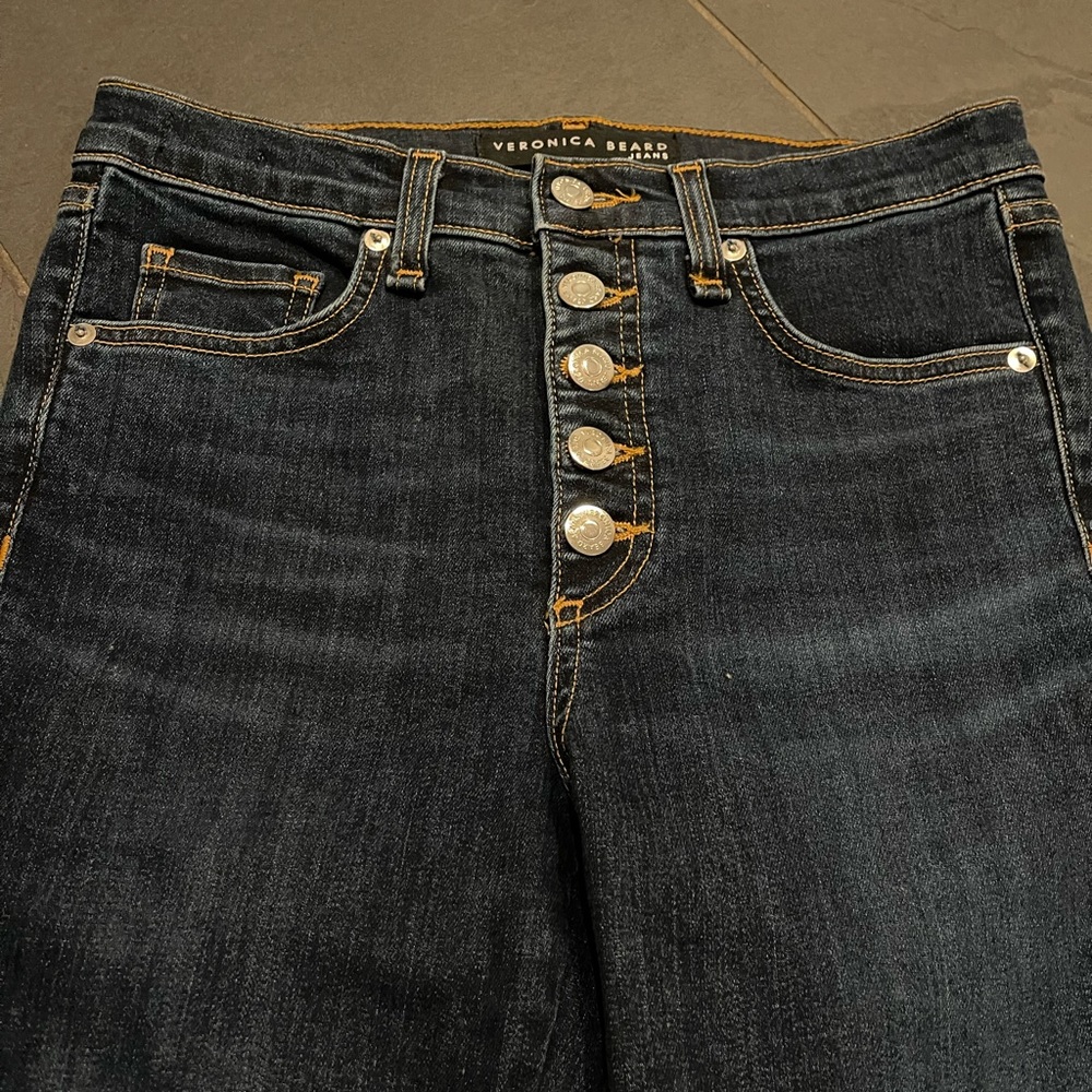 Veronica Beard boot crop jeans. Cute ribbon and snap detail. Size 27